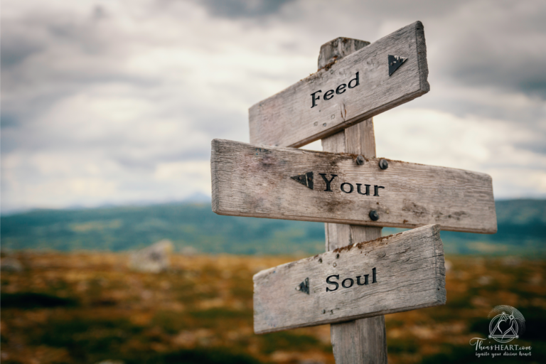 Rustic wooden signpost reading “Feed Your Soul” set against a serene mountain landscape, symbolizing spiritual guidance during uncertainty — Althea Provost.