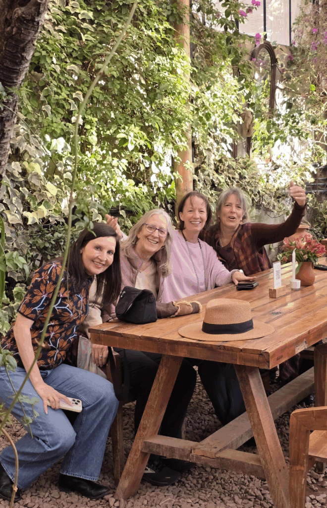 A group of starseeds sharing a vibrant meal at Green Point Vegan Restaurant in Cusco, Peru — a moment of connection, laughter, and spiritual resonance in the heart of the Sacred Valley.