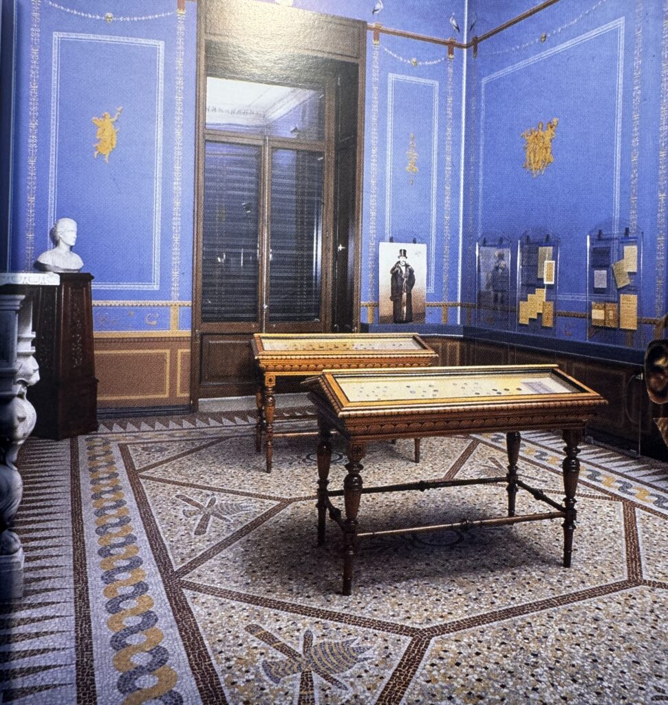 When Myth Becomes Memory — exhibition room in the Numismatic Museum, once Schliemann’s residence, showing cases where his coin collection was displayed.